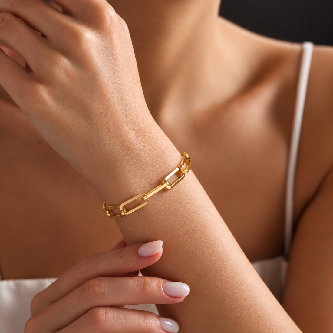 elle paperclip bracelet — close wrist campaign photograph, exact product design