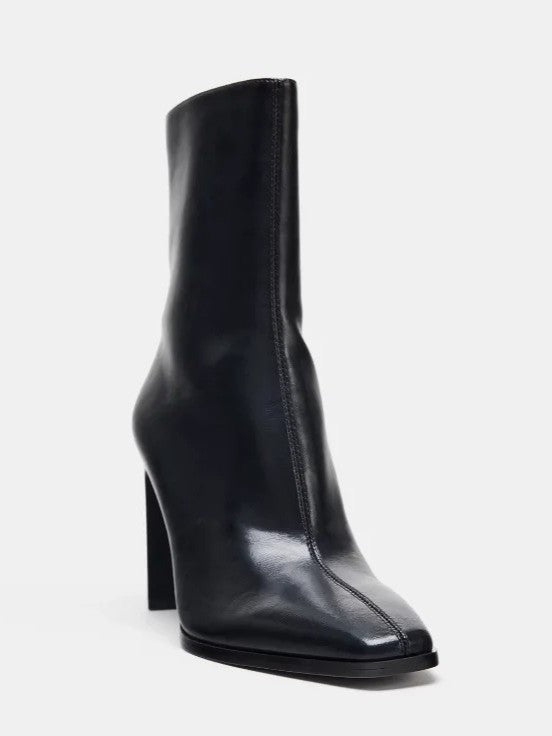Black high-heel ankle boot with a sleek square toe, smooth leather-look finish, structured shaft, and slim stiletto heel.
