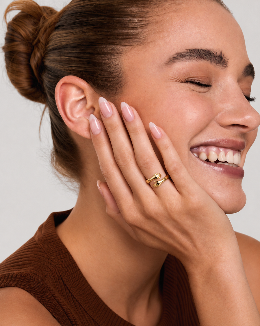 Hug ring in Gold worn on the finger — HORUS editorial campaign photograph