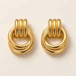 lia intertwined earrings macro — edited campaign photograph