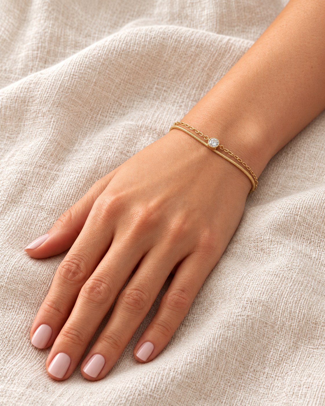 lumi layered bracelet worn covered — campaign product photograph