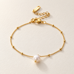 nora pearl bracelet macro — edited campaign photograph