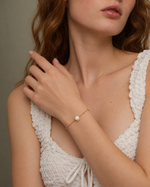 nora pearl bracelet worn — edited campaign photograph