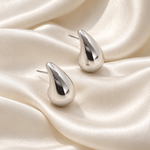 onde drop earrings satin — campaign product photograph
