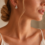 onde drop earrings — editorial photograph