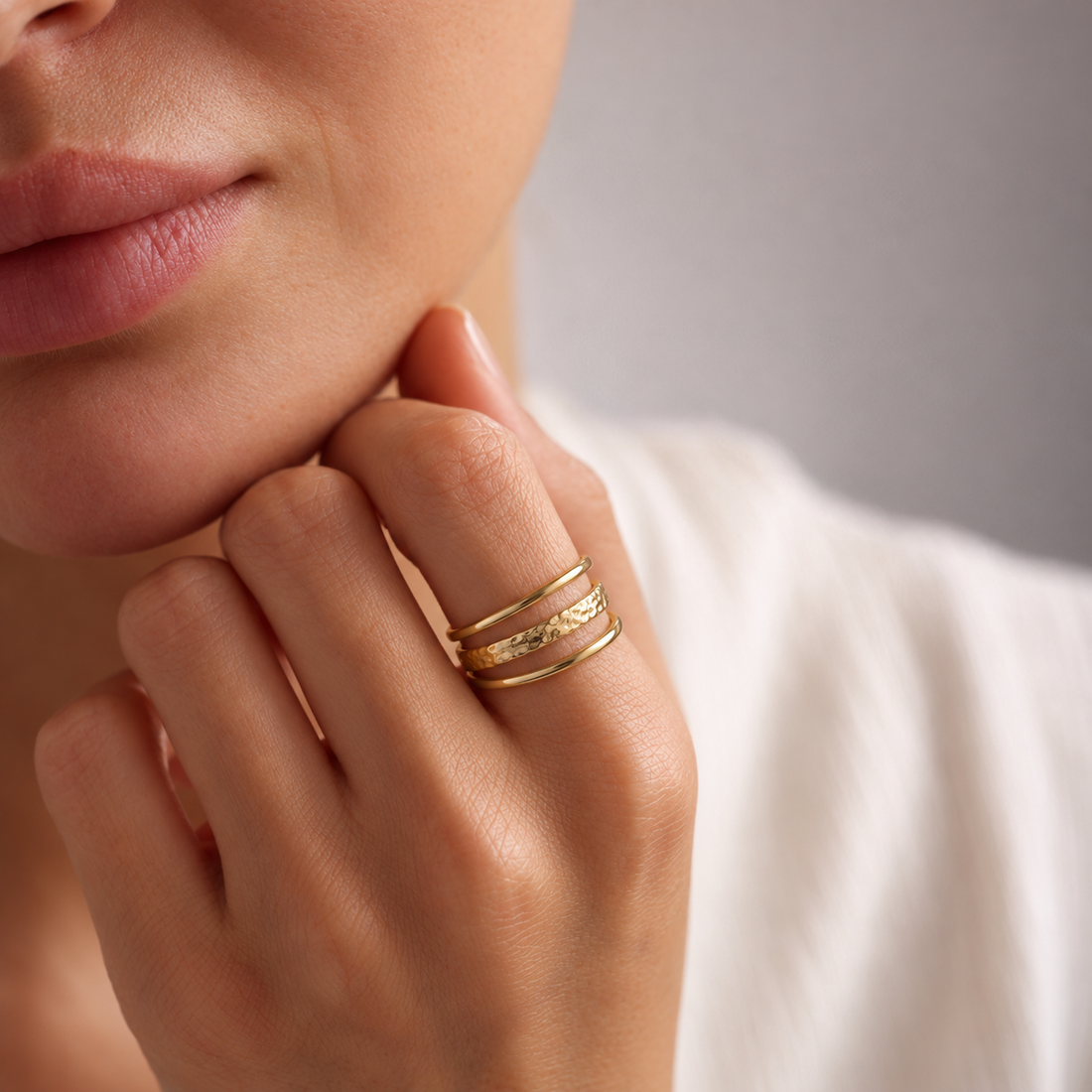 lia triple ring — editorial hand and ring photograph, exact catalogue design
