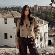 Beige boxy trench jacket with notched lapels and epaulettes