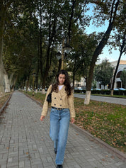 Full length view of the beige cropped double-breasted trench jacket